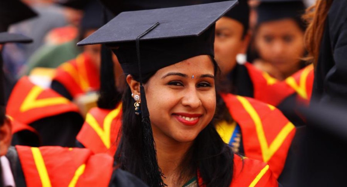 A graduate in cap and gown